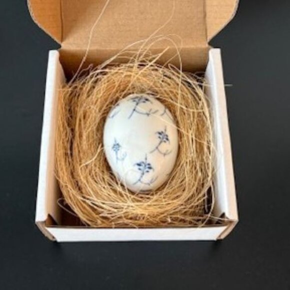 Royal Copenhagen Porcelain Blue Fluted Egg Ornament in Nest - 2.5 Inches - Picture 2 of 4